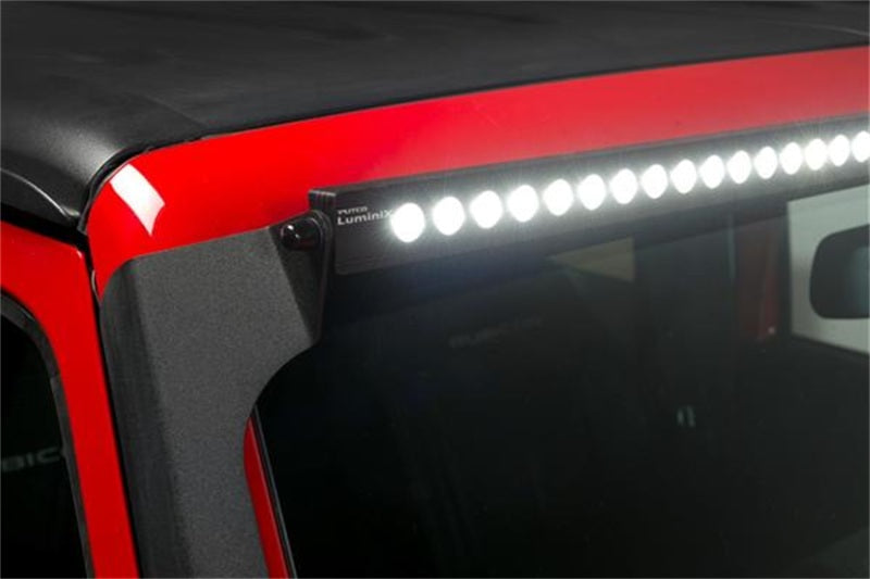Putco roof bracket kit for 2007-2018 Jeep Wrangler JK, 50-inch straight roof rack brackets installed on vehicle.