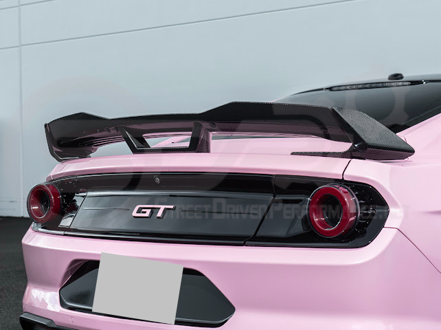 Dark Horse style carbon fiber rear wickerbill spoiler wing on a 2015-2023 Ford Mustang, showing its sleek aerodynamic design.