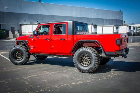 Steel rear bumper for 2018+ Jeep Gladiator by DV8 Offroad, rugged off-road bumper with mounting points and durable construction.