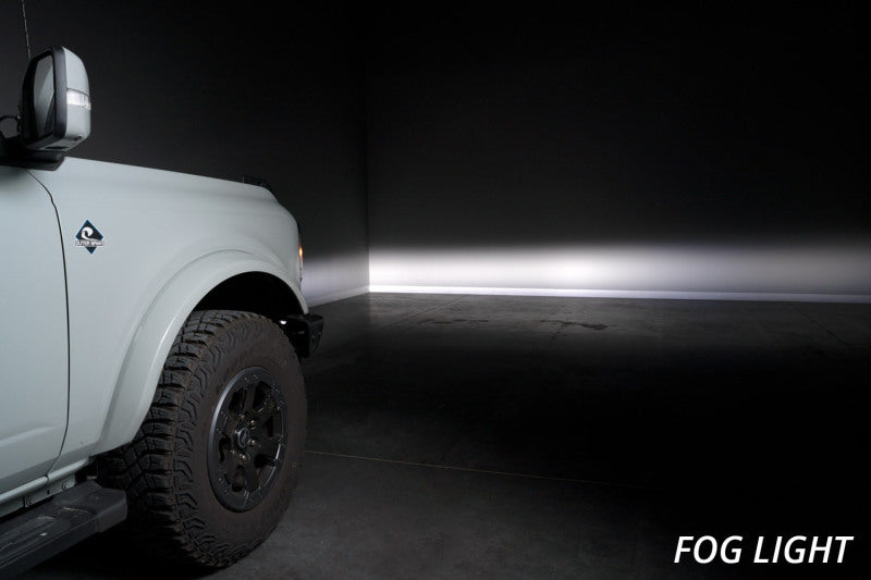 Diode Dynamics 21-Up Ford Bronco Stage Series yellow fog lights installed in the fog pocket, showcasing their compact design and vibrant yellow color.