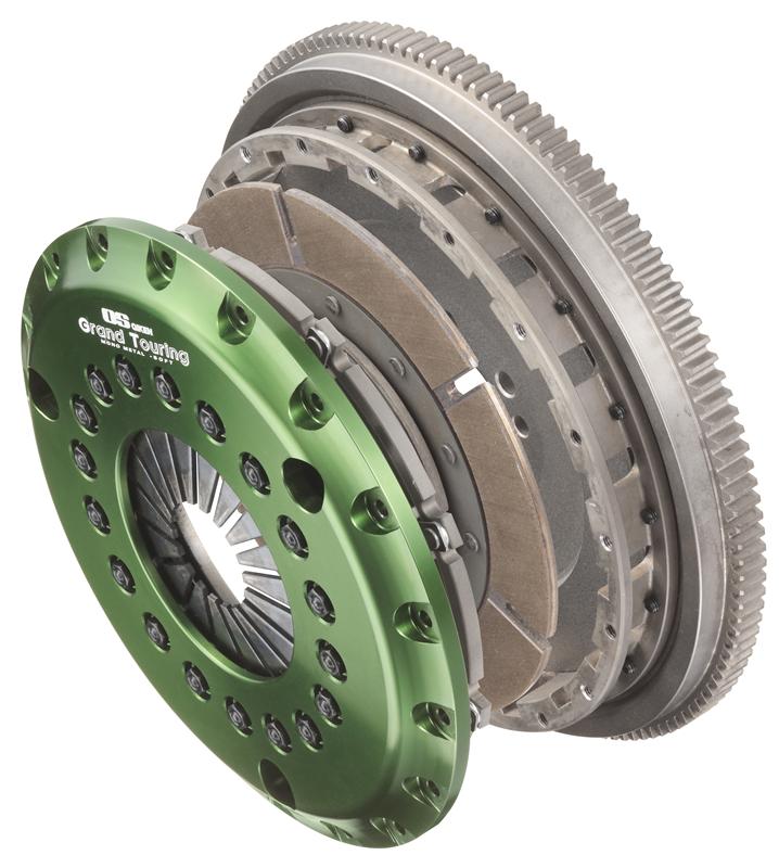 OS Giken Nissan Skyline R34 GT-R GT Twin Plate Dampened Clutch kit with pressure plate and clutch disc, detailed metal components.
