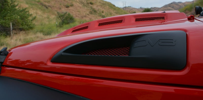 DV8 Offroad Jeep Wrangler JK metal heat dispersion hood in primer black, designed for 2007-2018 models, showcasing its rugged construction.
