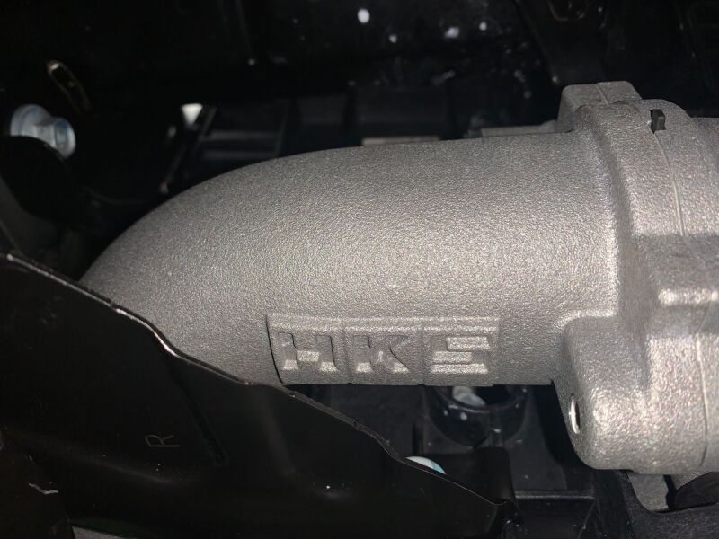 HKS Honda Civic Type R FL5 intercooler kit installed, showing the sleek aluminum intercooler with HKS branding for performance cooling.