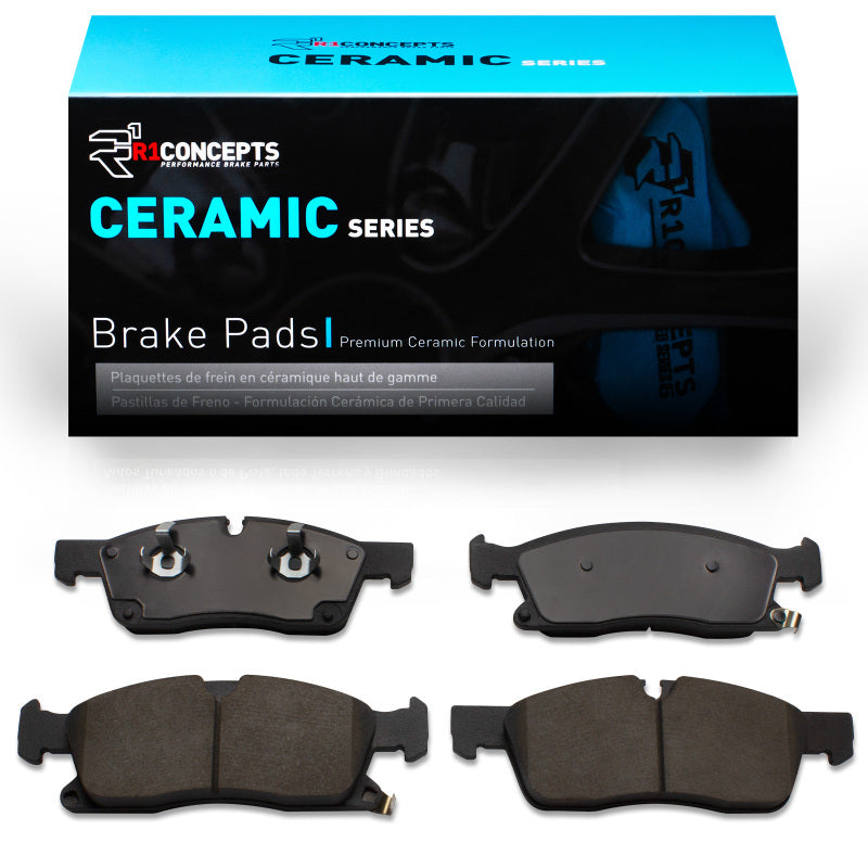 R1 Concepts R1 11-22 Dodge Durango OE ceramic brake pads installed on front wheels, showing brake pad design and surface.