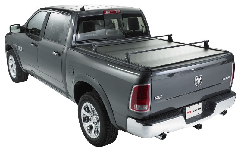 Pace Edwards UltraGroove retractable electric bed cover on a 2017 Toyota Tundra CrewMax with 5ft 5in bed, sleek black design.