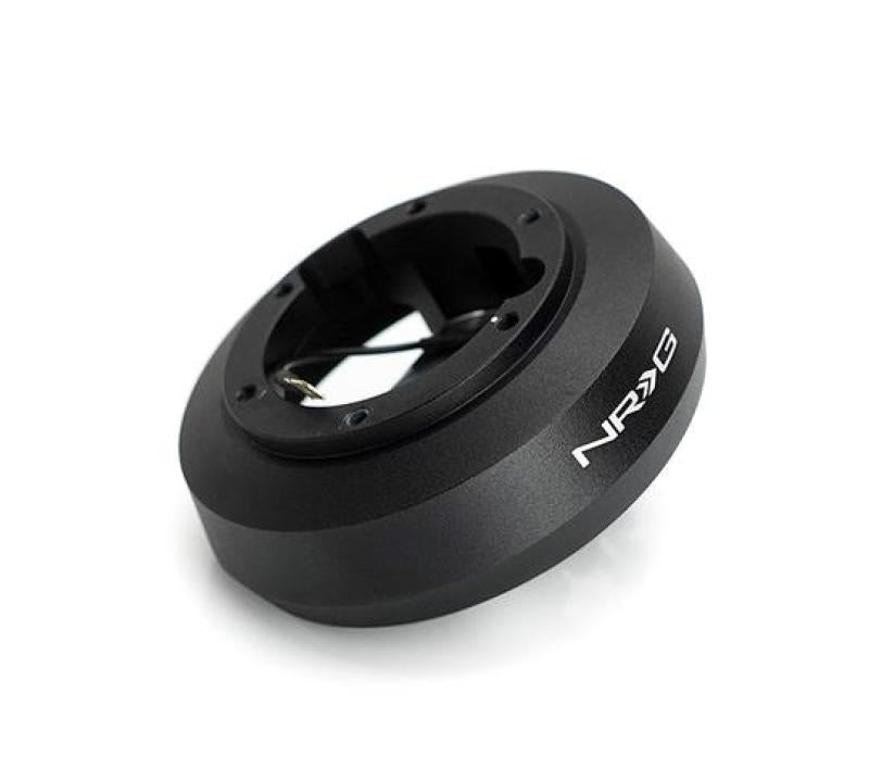 NRG short steering wheel hub for Mazda 6, Ford Focus, Fiesta, and Mustang, showing the black hub with mounting details.