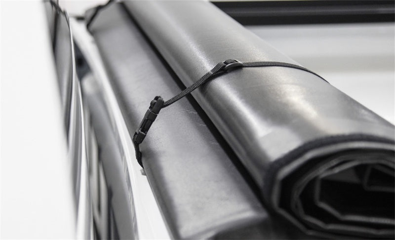Access Literider roll-up truck bed cover on Ford Explorer Sport Trac with 4ft 2in bed, bolt-on exterior truck bed accessory.