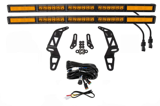 Diode Dynamics SS30 bumper bracket kit for 2018-2021 Jeep JL Wrangler/Gladiator with amber dual LED light bars installed on front bumper.