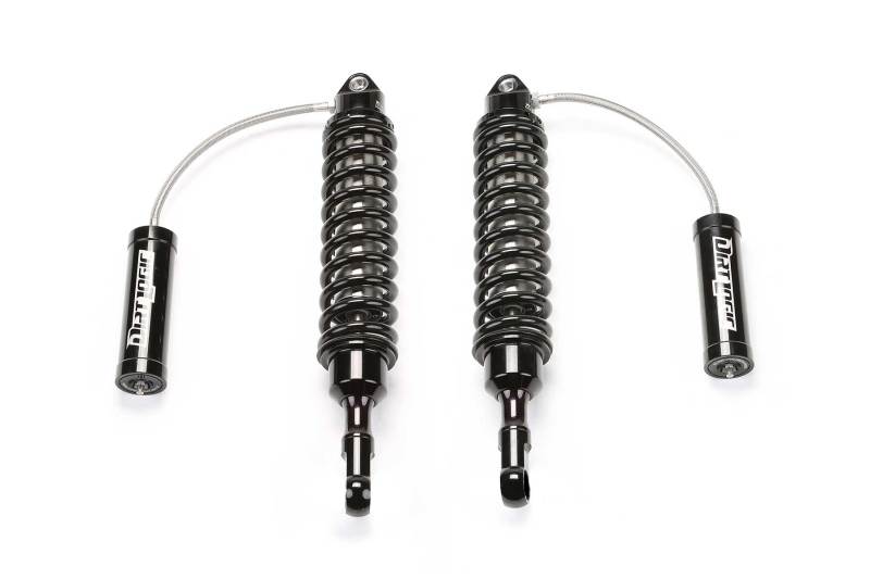 Pair of Fabtech Dirt Logic 2.5 coilover shocks for 2015-2018 Ford F150 2WD front suspension, featuring reservoir design.