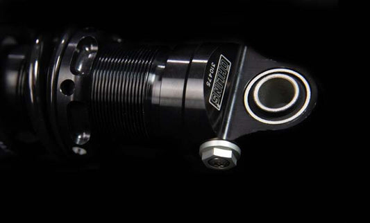 Ohlins black shock absorber for Harley-Davidson FL Touring 2006-2022, model STX 36, mounted on motorcycle suspension system