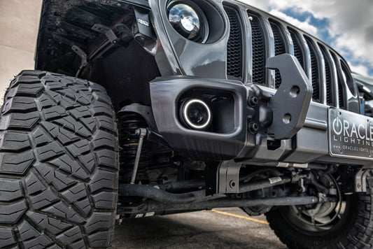 Oracle Lighting high-performance LED fog lights for Jeep Wrangler JK/JL/JT models, shown with mounting brackets and LED bulbs.