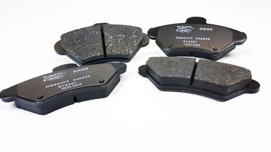 Baer Brakes performance claw brake pads for 1994-1998 Ford Mustang, showing the metal backing and brake pad friction surface.