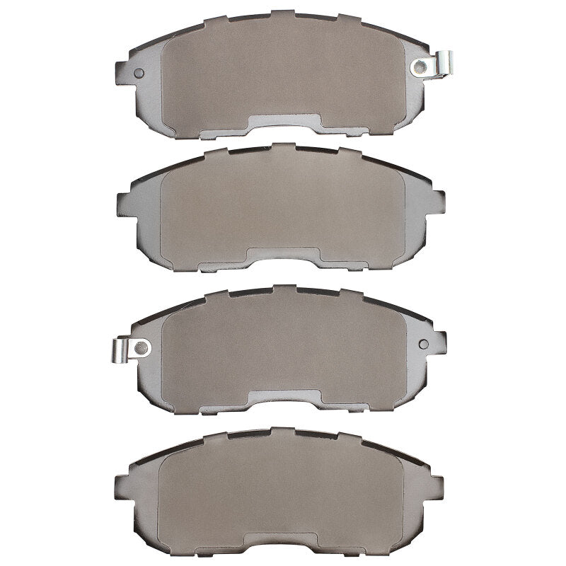 Nissan Sentra 1989-06 R1 Concepts OE brake pads installed in front brake assembly, showing metal backing and friction material
