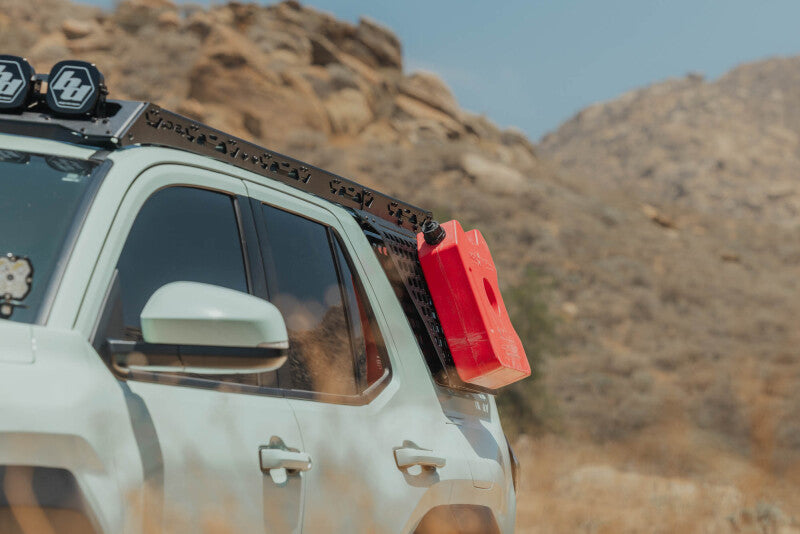 DV8 Offroad Toyota 4Runner exterior window molle panel for DV8 roof rack on driver side, part of the vehicle’s exterior trim.