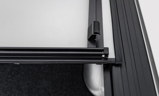 Access 02-18 Ram 1500 and 03-18 Ram 2500/3500 folding bed cover with diamond plate finish on truck bed.