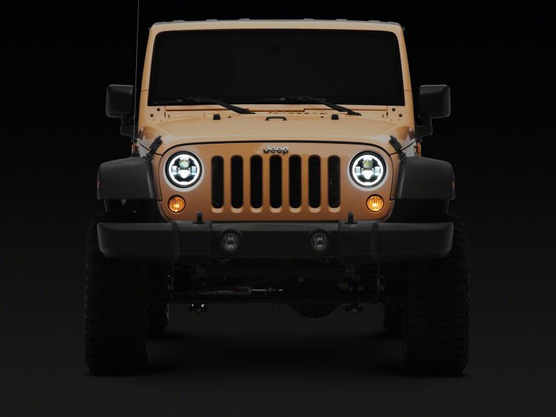 Raxiom 07-18 Jeep Wrangler LED headlights with black housing, clear lens, DRL, and 7-inch axial series for enhanced visibility.