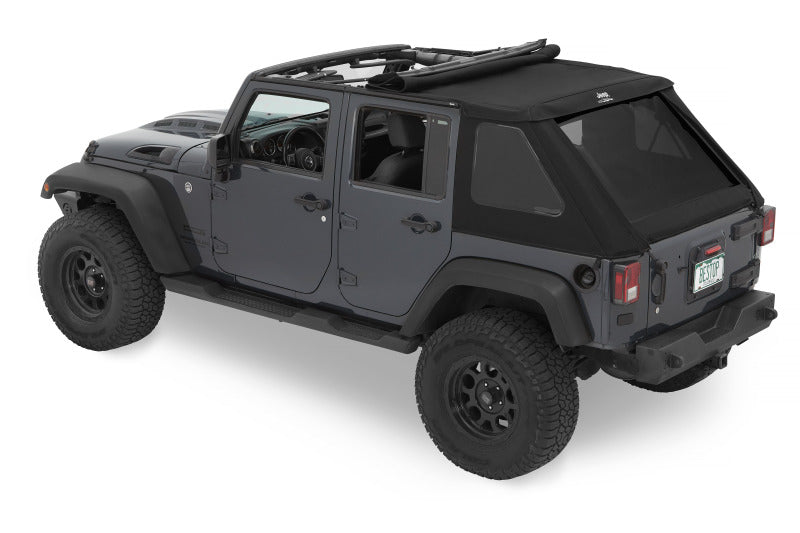 Bestop Jeep Trektop soft top for 2007-2018 Jeep Wrangler JK 4-door in black Twill fabric, installed on vehicle with open roof sections.