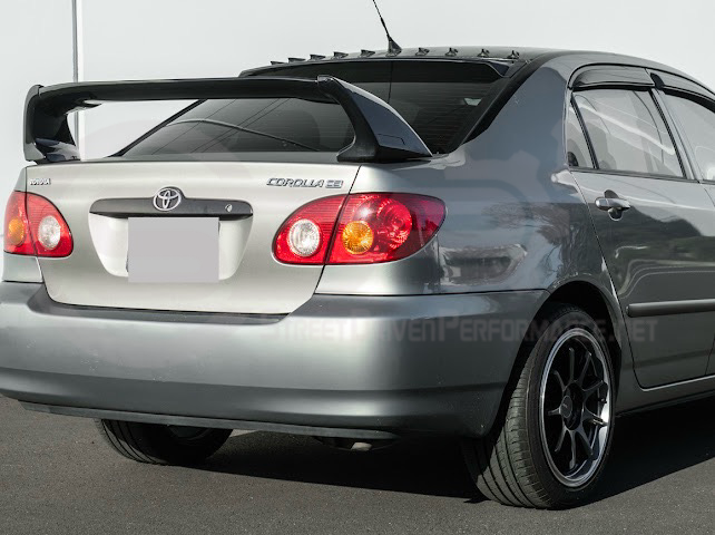 2003-2008 Toyota Corolla | JDM Tape-On Tinted Black Rear Roof Window Visor Guard