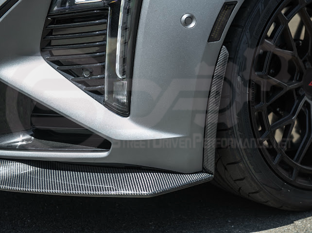 Cadillac CT5-V Blackwing factory OEM style carbon fiber front lip splitter and wheel arches, ground effects for enhanced performance.