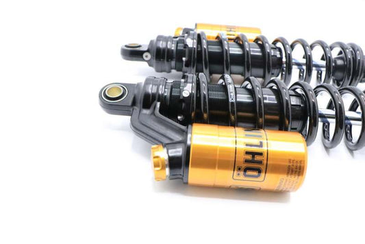 Ohlins black and gold shock absorber for Harley-Davidson Dyna FXD 91-17, designed for enhanced ride performance.
