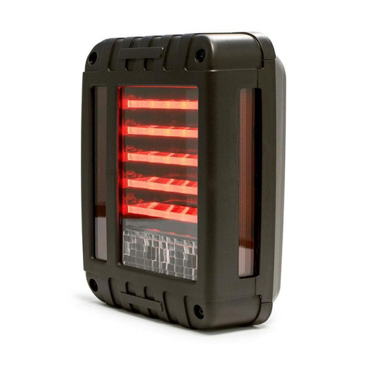 DV8 Offroad Jeep Wrangler JK octagon LED tail light, close-up view showcasing bright red lens and durable housing.