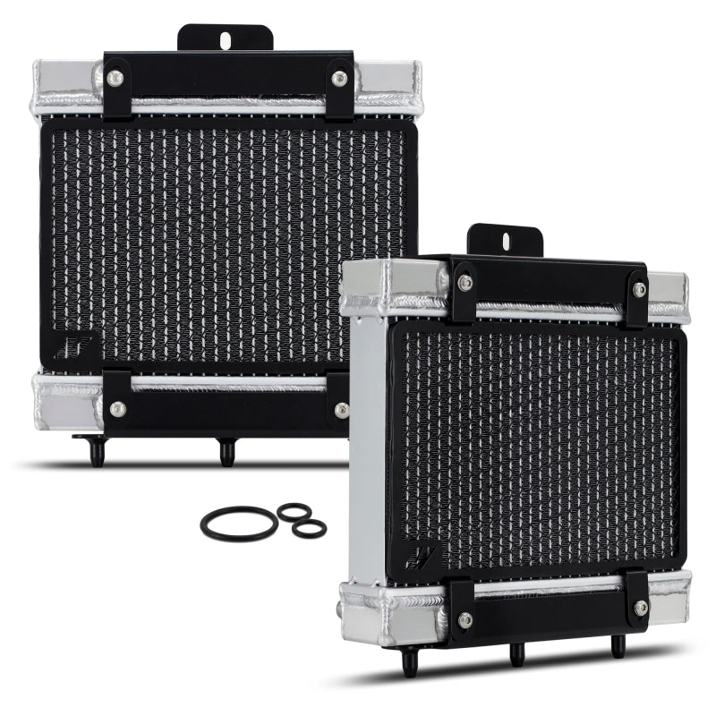 Mishimoto 15-20 BMW F8X M3/M4 performance auxiliary radiator installed in engine bay, showing core and inlet connections