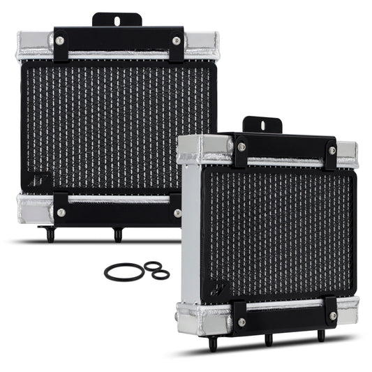 Mishimoto 15-20 BMW F8X M3/M4 performance auxiliary radiator installed in engine bay, showing core and inlet connections
