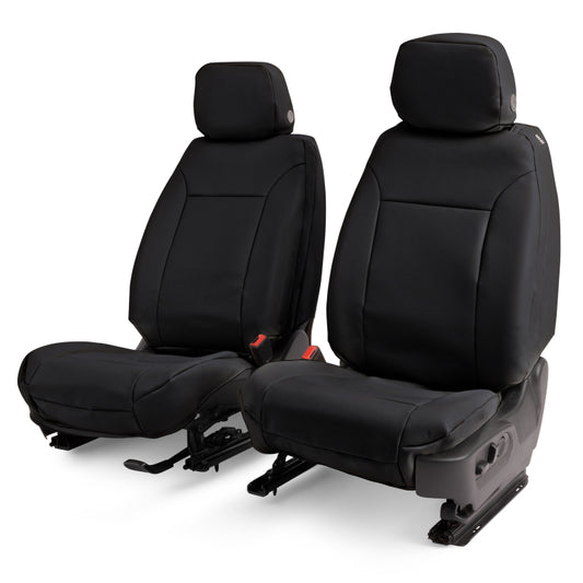 Covercraft black leatherette front seat covers installed in a 2025 Ford Explorer, custom-fit for the vehicle's front row seats.