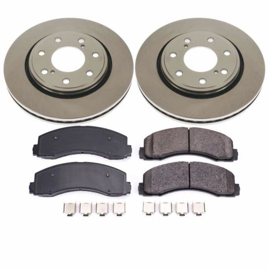 PowerStop OE front brake kit for 2010-2014 Ford F-150, including brake rotors and pads, installed on vehicle front axle.
