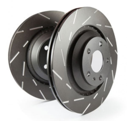 EBC Brakes USR slotted brake rotors installed on a vehicle's wheel, showcasing their durable slotted design for improved braking performance.