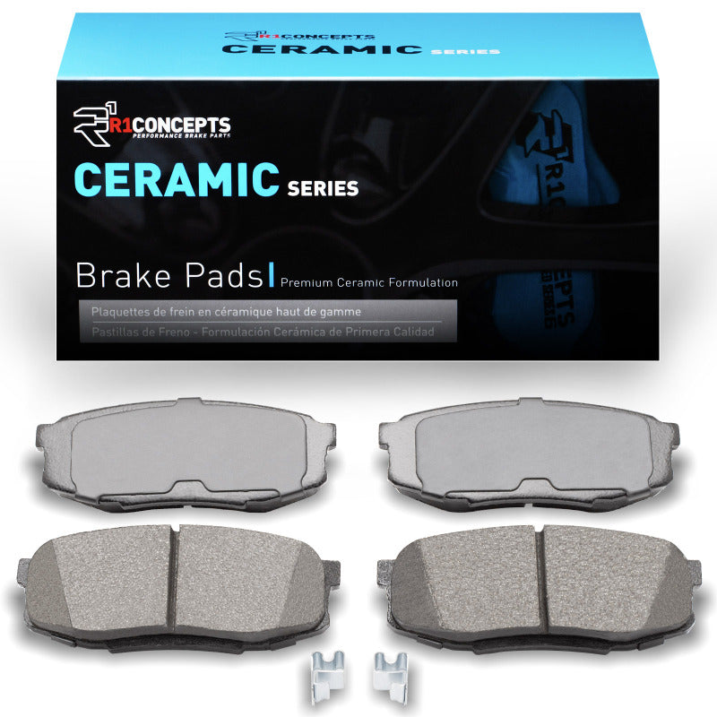 R1 Concepts Lexus LX570 rear ceramic brake pads, OE quality, with R1 branding, shown installed on vehicle brake system.