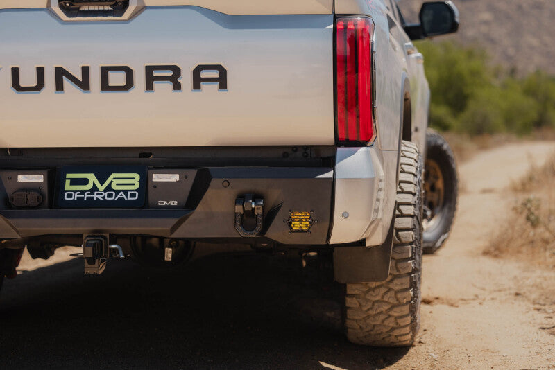 Steel rear bumper for Toyota Tundra DV8 Offroad Spec Series 22-26 model, featuring robust off-road design.