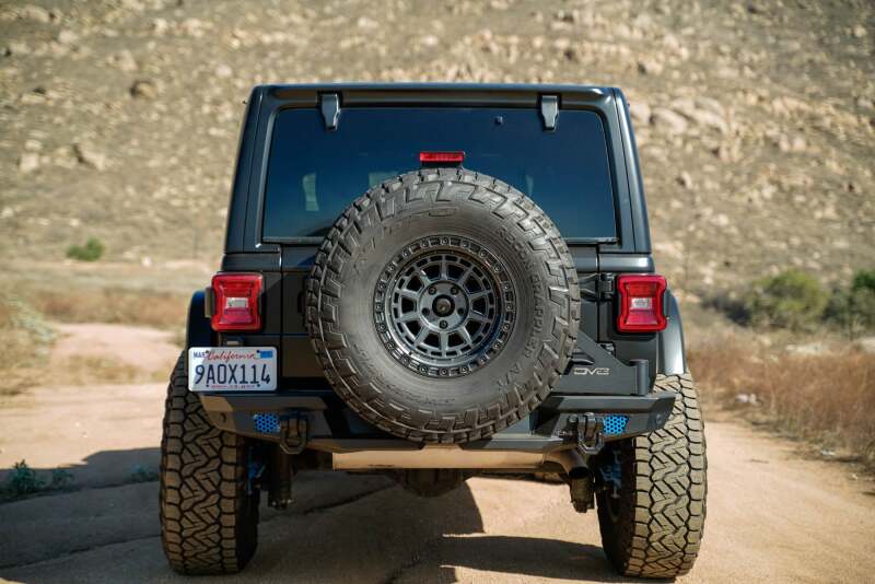 DV8 Offroad Jeep Wrangler JL MTO Series bumper tailgate with spare tire swing gate, showcasing durable offroad accessory.