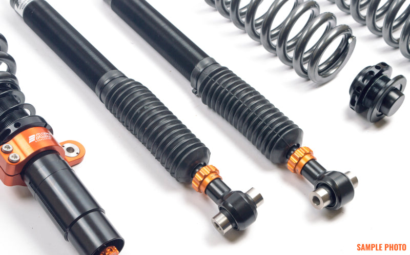 AST 5100 Series coilovers for BMW 1 Series rear suspension, showing coilover shock absorber with mounting hardware.