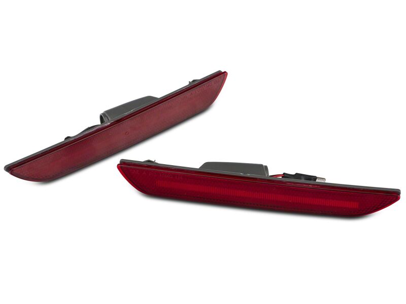 Red Raxiom 15-23 Ford Mustang Axial Series LED rear side marker lights on a vehicle, highlighting their sleek design.