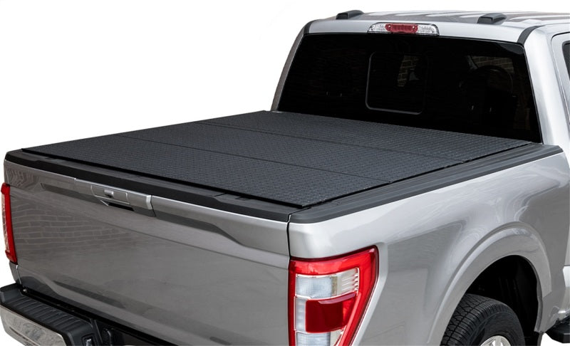 Access LOMAX Pro Series hard fold tonneau cover for 2020 Nissan Frontier 5ft bed in black diamond mist, durable truck bed protection.