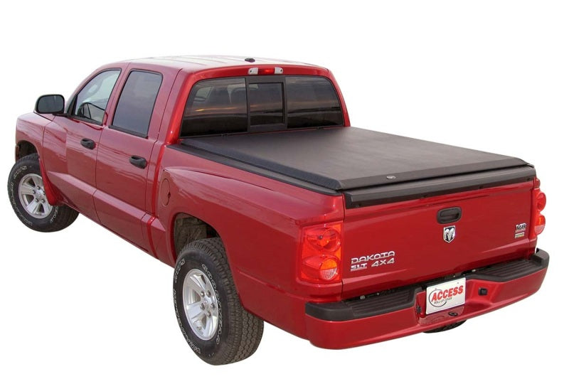 Access Limited roll-up truck bed cover on a Dodge Dakota Crew Cab with utility rails, designed for 5ft 4in bed protection.