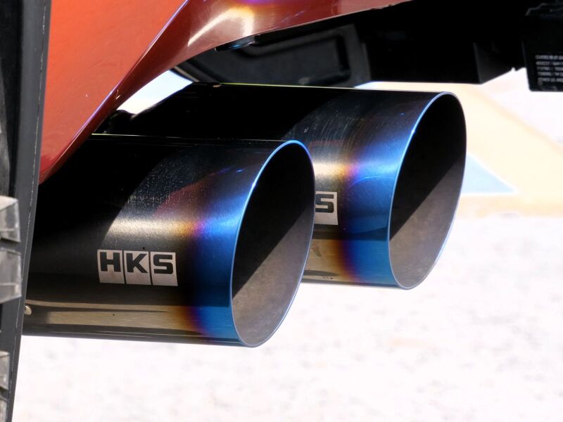 HKS Legamax Trail Master 2022 Tundra catback exhaust system installed on a pickup truck, showcasing the polished exhaust tip.