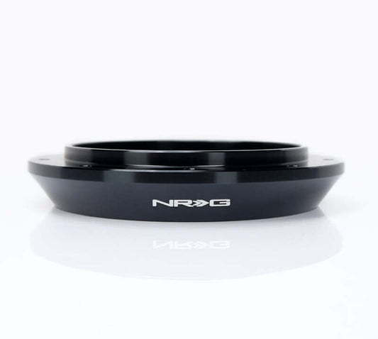 NRG 6 to 9 hole steering wheel hub adapter for quick and secure installation in automotive steering systems.