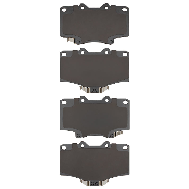 Toyota 4Runner R1 Concepts OE brake pads, front R1 Optimum series, showing black rubber and metal backing plates.