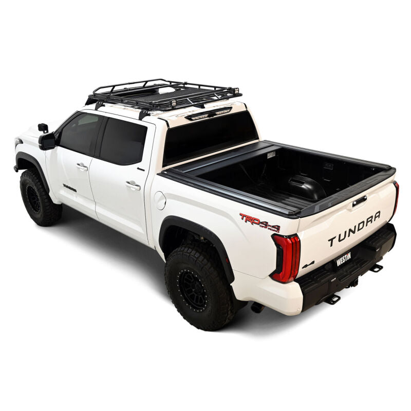 Westin manual retractable tonneau cover for 2022-2026 Toyota Tundra with 5.5ft bed, black roll-up style in the image.