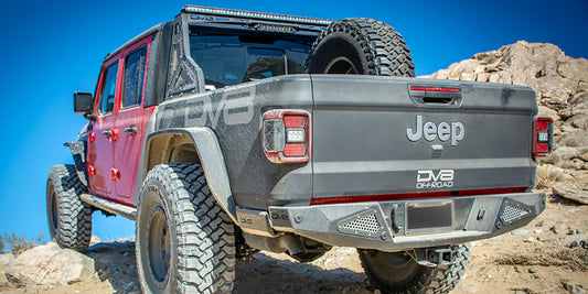 DV8 Offroad Jeep Gladiator 2019+ bedside sliders, durable exterior body armor and rock rails for off-road protection.