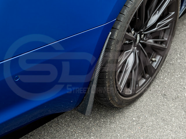 Pair of carbon fiber front and rear mud flaps for 2022-up Cadillac CT5-V Blackwing by Street Driven Performance.