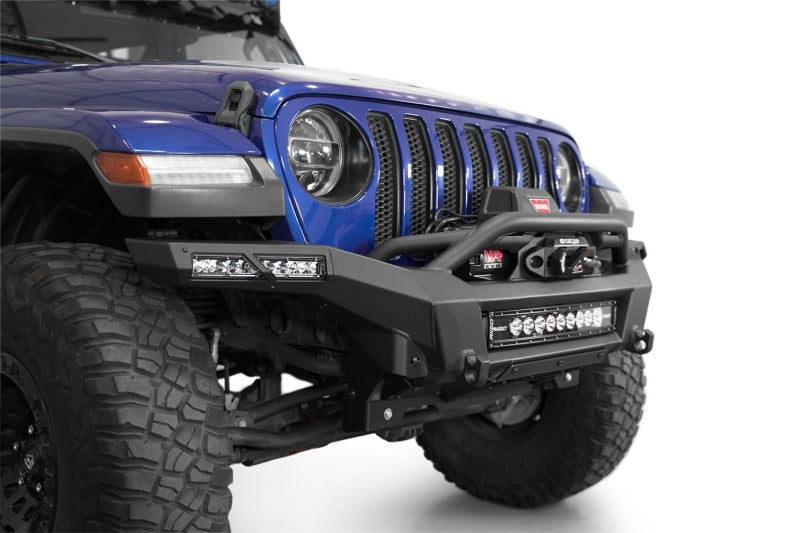 Addictive Desert Designs steel rear bumper for Jeep Wrangler JL and Gladiator JT with integrated winch mount and rugged black finish.