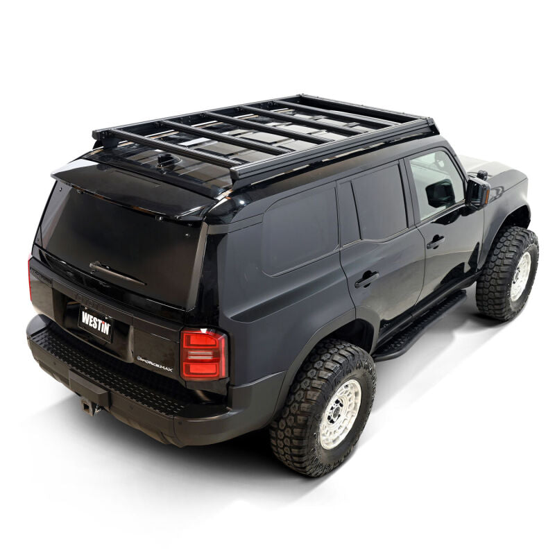Westin 2026 Toyota Land Cruiser Mesa roof rack mounted on vehicle roof with crossbars and mounting hardware.