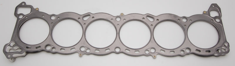 Cometic Nissan RB-26 6-cylinder MLS head gasket with 87mm bore and .075 inch thickness, showing the gasket's surface detail.