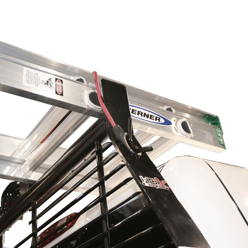 Westin black headache rack mounted on Chevrolet Silverado pickup truck, providing cargo protection and truck bed security.