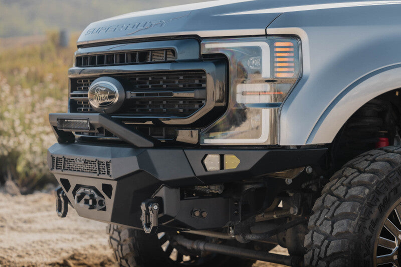 Steel front bumper from DV8 Offroad for Ford Super Duty F-250/F-350 (2017-2022) with rugged design and mounting points.