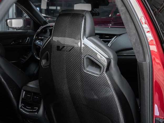 Cadillac ATS-V sedan Recaro carbon fiber seat rear panel cover replacement, driver and passenger side, showing sleek black design.