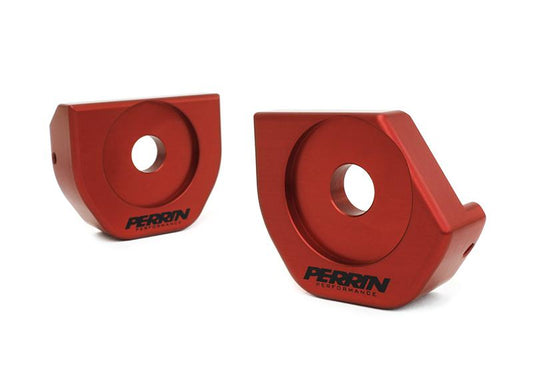 Perrin Performance steering rack lockdown kit bushing for Subaru WRX 2005-2014 and STI 2005-2021, close-up of bushings.